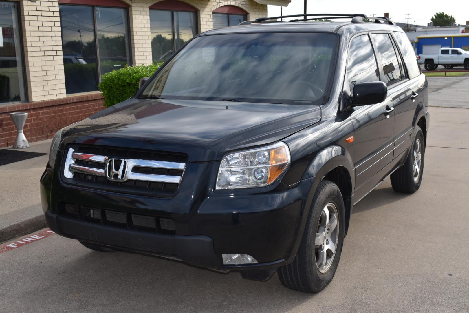 2006 Black /Brown Honda Pilot EX w/ Leather (5FNYF28556B) with an 3.5L V6 SOHC 24V engine, 5-Speed Automatic Overdrive transmission, located at 5925 E. BELKNAP ST., HALTOM CITY, TX, 76117, (817) 834-4222, 32.803799, -97.259003 - Buying a 2006 Honda Pilot EX can offer several benefits, building upon the strengths of its predecessors while incorporating some improvements. Here are some potential advantages: Reliability: Honda has a strong reputation for building reliable vehicles, and the 2006 Pilot is no exception. By 2006, - Photo#1